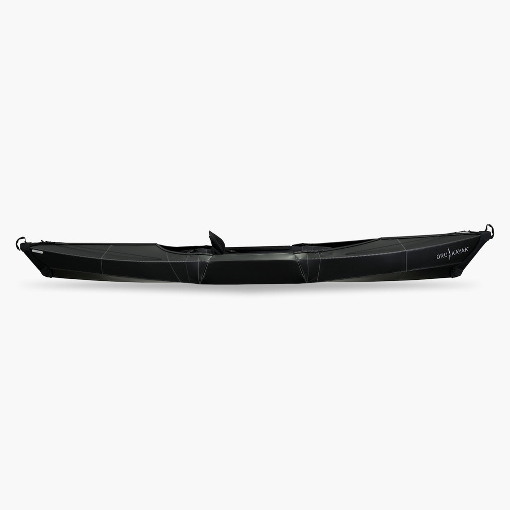 Side view of the Oru Kayak Beach Sport model in black.