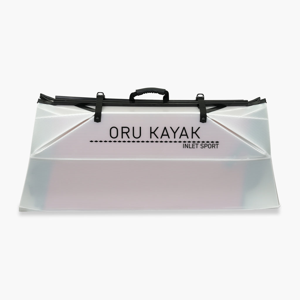 Folded white Oru Kayak Inlet Sport model in white in box form.