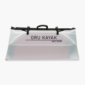 Folded white Oru Kayak Inlet Sport model in white in box form.