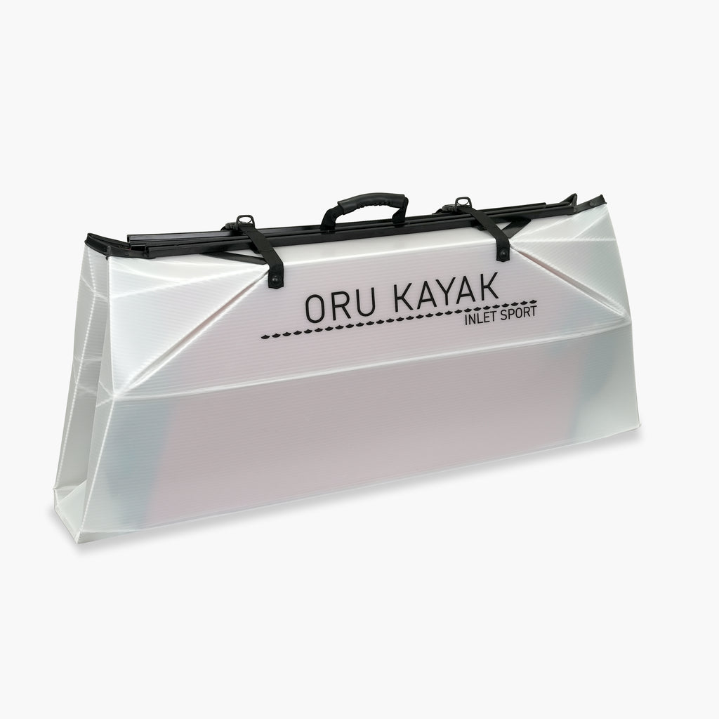 Side folded white Oru Kayak Inlet Sport model in white in box form.