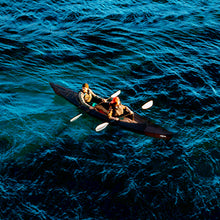 2 people and dog kayaking on a haven tt kayak black edition